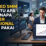 Ilustrasi seorang reseller profesional sedang memantau grafik di dashboard Drip Feed SMM Panel melalui laptop. Gambar dilengkapi teks judul 'Drip Feed SMM Panel Itu Apa dan Kenapa Reseller Profesional Selalu Pakai' serta subjudul tentang strategi pertumbuhan bertahap untuk bisnis SMM, dikelilingi ikon media sosial seperti TikTok, Instagram, dan YouTube